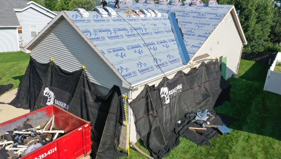 A house with a partially replaced roof